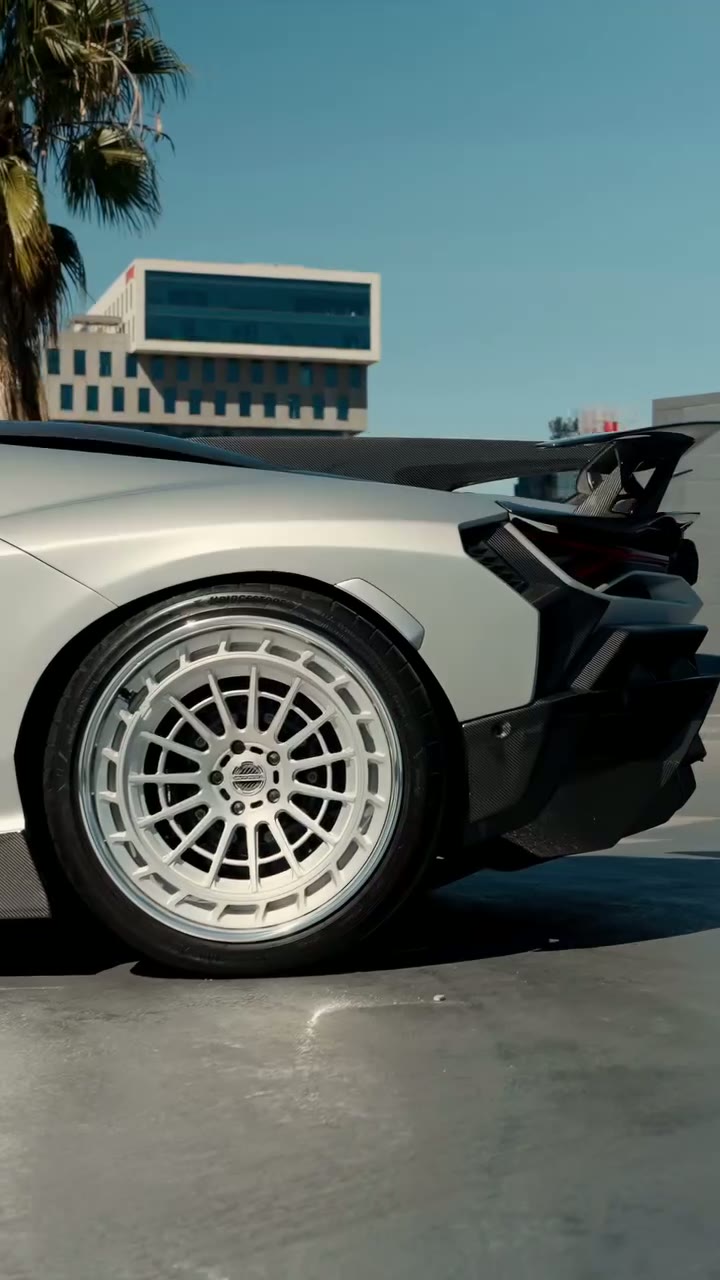 Matte grey Lamborghini after its wrap, filmed up close in sunlight