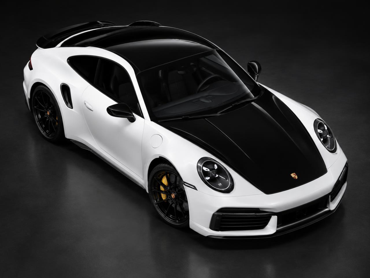 White coupe with gloss black roof and hood